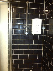 Black tiled wall before